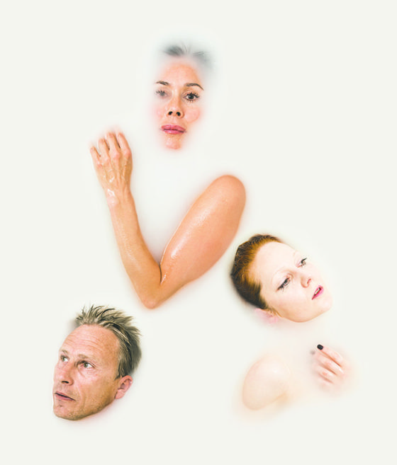 poster with 3 naked actors lying in white water