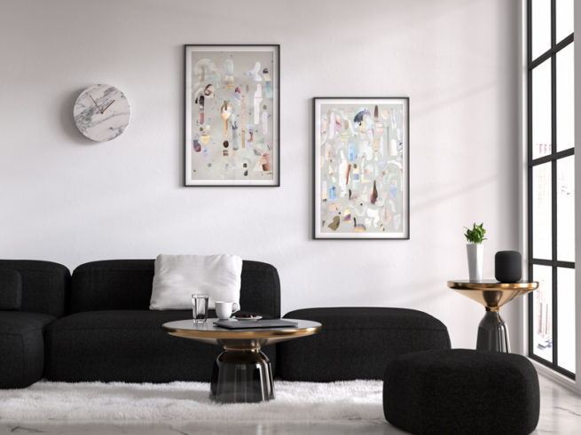 Stue med sort sofa collage plakat hængende i sorte rammer